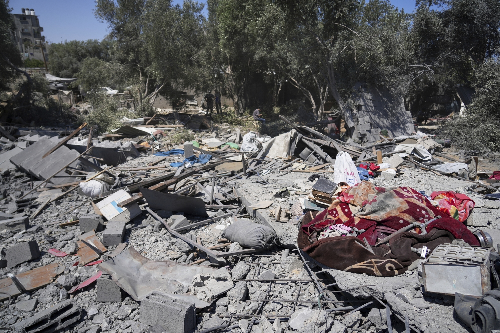Six children among 10 people killed at water collection point by Israeli strike