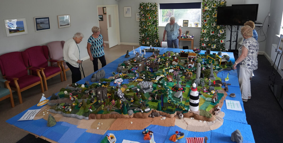 Some of the knitters in Carnew Community Care centre in Carnew, Co Wicklow, with their knitted map of Ireland. Picture: Niall Carson/PA
