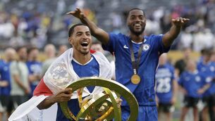 <p>Chelsea's Levi Colwill holds the trophy after the Club World Cup final soccer match between Chelsea and PSG. Adam Hunger/AP</p>