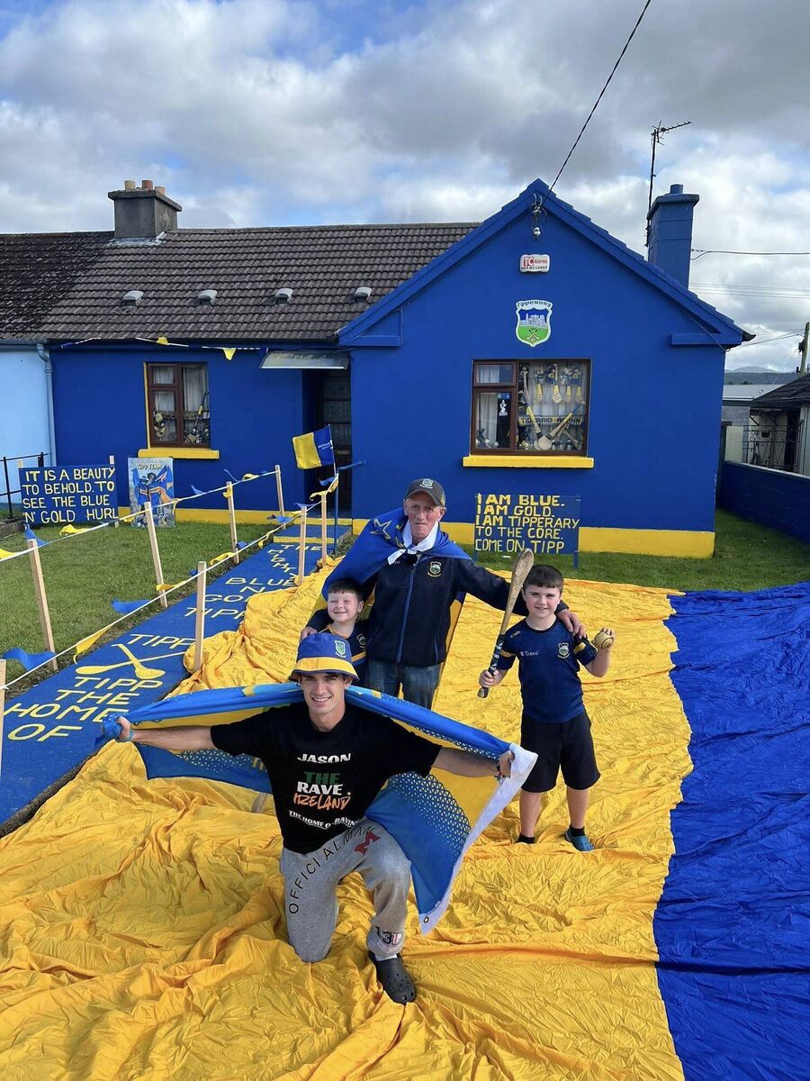 Tipperary superfan James 'Sid' Ryan, front, with his nephew, Jason Murphy, and neighbours Daragh and Connor O’Donnell, in the garden of his blue and gold house on the Cashel Road. Picture: Stevie O'Donnell, Tipperary Mid West Radio Tipperary superfan James 'Sid' Ryan, front, with his nephew, Jason Murphy, and neighbours Daragh and Connor O’Donnell, in the garden of his blue and gold house on the Cashel Road. Picture: Stevie O'Donnell, Tipperary Mid West Radio