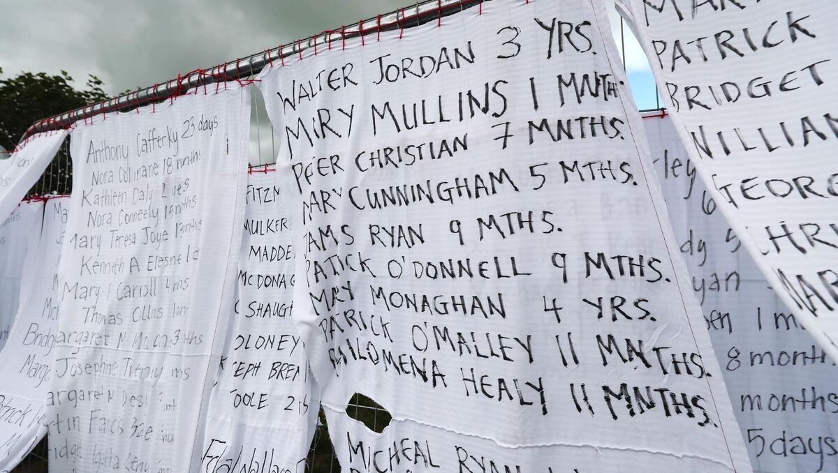 Bed sheets with the names of hundreds of dead children draped on the gates of a mass burial site in Tuam, Co Galway. Picture: Niall Carson/PA Wire Bed sheets with the names of hundreds of dead children draped on the gates of a mass burial site in Tuam, Co Galway. Picture: Niall Carson/PA Wire