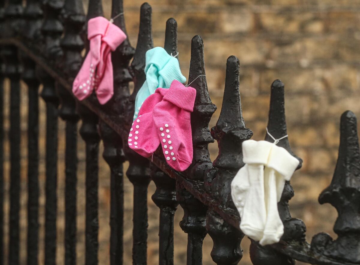 Children's socks left on railings outside the offices of the the mother and baby homes Commission of Inquiry in 2021. Picture: Damien Storan Children's socks left on railings outside the offices of the the mother and baby homes Commission of Inquiry in 2021. Picture: Damien Storan