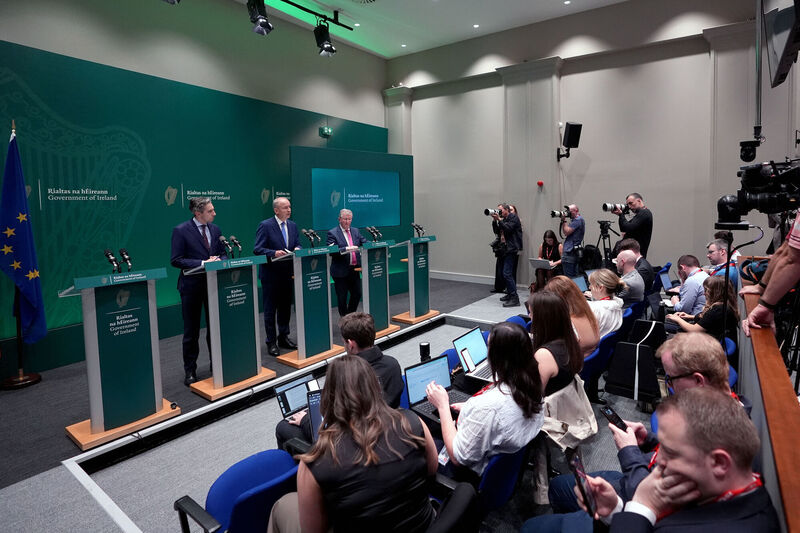 Tánaiste Simon Harris, Taoiseach Micheál Martin and Sean Canney, Independent TD for Galway East, speaking to the media at a press conference for the launch of the Government's Summer economic statement and the National development plan for the next 5 years, at the Government Buildings, Dublin. Picture: Niall Carson/PA Wire Tánaiste Simon Harris, Taoiseach Micheál Martin and Sean Canney, Independent TD for Galway East, speaking to the media at a press conference for the launch of the Government's Summer economic statement and the National development plan for the next 5 years, at the Government Buildings, Dublin. Picture: Niall Carson/PA Wire