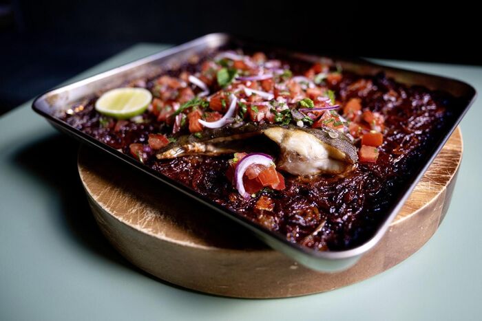 Whole baked plaice with smoky onions & tomato salsa