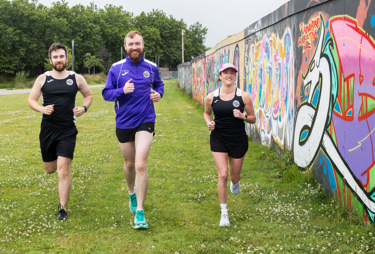 Jack Mulcahy, Rónan Murray and Emma Harrington of Frontrunners and Briskwalkers, Cork out for a run on the Marina, Cork. Picture: David Creedon