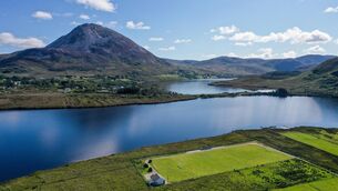<p>An aerial view of Glentornan Park, home of Dunlewey Celtic, in Donegal. The pitch is on the shore of Dunlewey Lough, and at the base of Mount Errigal, which is Donegal's tallest peak at 751m. File picture: Ramsey Cardy/Sportsfile</p>