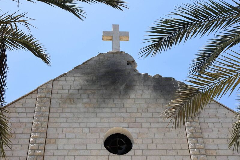 The damaged facade of the Holy Family Church a day after it was hit in an Israeli strike in Gaza City last week which killed three in the besieged Palestinian territory's only Catholic church. Photo: Omar Al-Qattaa/AFP via Getty Images