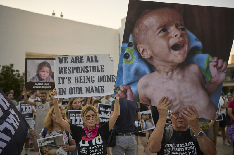 Israeli activists take part in a protest in Tel Aviv, Israel, last week against the war in the Gaza Strip, Israel's measures regarding food distribution and the forced displacement of Palestinians. Photo: AP/Ohad Zwigenberg