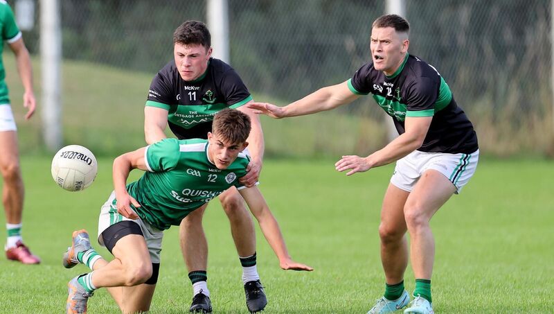  Mark Cronin and Kevin O'Donovan, Nemo Rangers, Ben O'Connell, Ballincollig. Pic: Jim Coughlan.