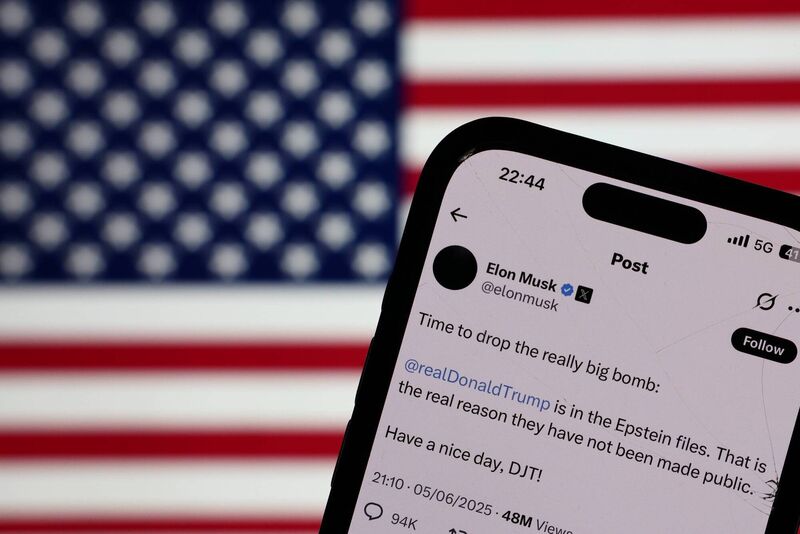 American flag displayed on a screen and Elon Musk post about Donald Trump on X are seen in this illustration photo taken in Krakow, Poland on June 5, 2025. (Photo by Jakub Porzycki/NurPhoto via Getty Images)