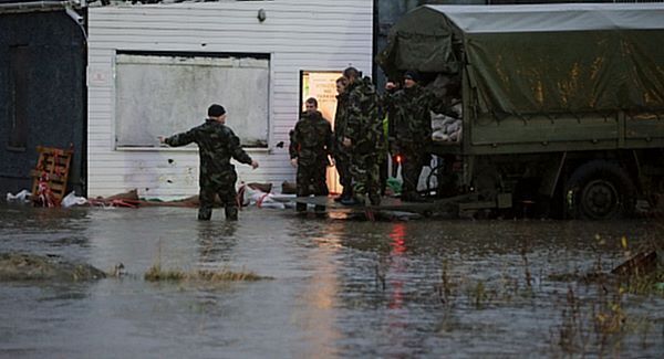 Members of the Army bail out water from shops in the Ballybofey area of Donegal. Pic: PA