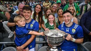<p>CHAMPIONS: Kerry's David Clifford and his son Ogie, left, and brother Paudie Clifford, right, celebrate with family after the GAA Football All-Ireland Senior Championship final. Pic: Stephen McCarthy/Sportsfile</p>