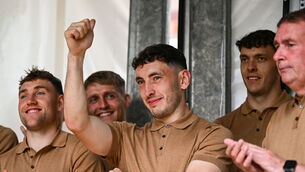 <p>Kerry player Paudie Clifford, centre, gestures to the crowd during homecoming celebrations in Tralee. Pic: Piaras Ó Mídheach/Sportsfile</p>