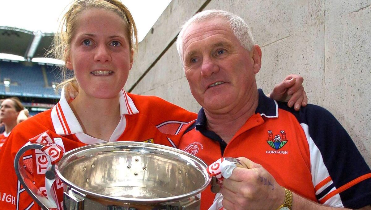 Cork captain Juliet Murphy with coach Eamonn Ryan after victory in 2005.