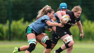 <p>ON THE MEND: Jane Clohessy tackles Aoife Wafer, who is hoping to make the Rugby World Cup. Pic: ©INPHO/Ben Brady</p>