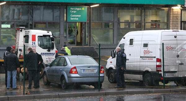 Gardaí examine a GSLS security cash in transit van in the cargo area of Dublin Airport this morning after the incident. Picture Colin Keegan. Gardaí examine a GSLS security cash in transit van in the cargo area of Dublin Airport this morning after the incident. Picture Colin Keegan.