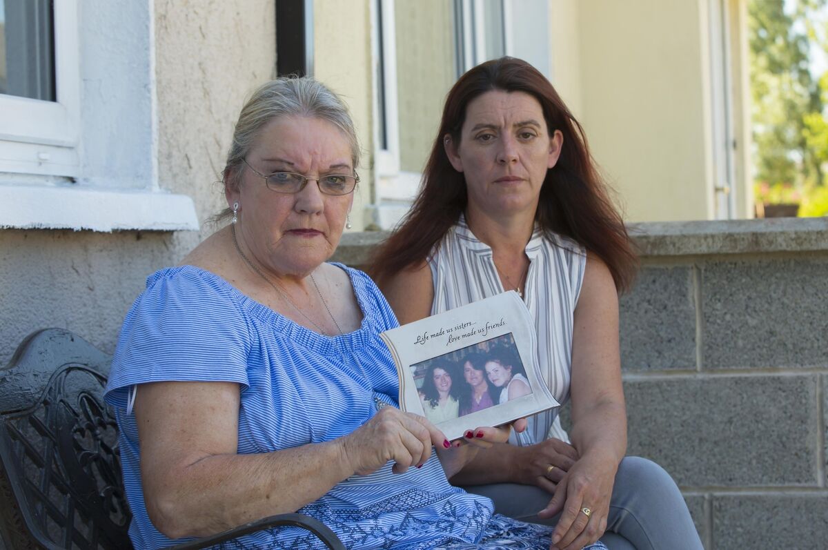Fiona's mum, Mary, and sister, Diane, with a picture of Fiona and her siblings. File picture: Patrick Browne Fiona's mum, Mary, and sister, Diane, with a picture of Fiona and her siblings. File picture: Patrick Browne
