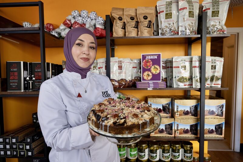Eman Alkarajeh pictured with a cake baked using a recipe from the new book Jibrin at Izz Café, Cork City. Picture Chani Anderson. Eman Alkarajeh pictured with a cake baked using a recipe from the new book Jibrin at Izz Café, Cork City. Picture Chani Anderson.