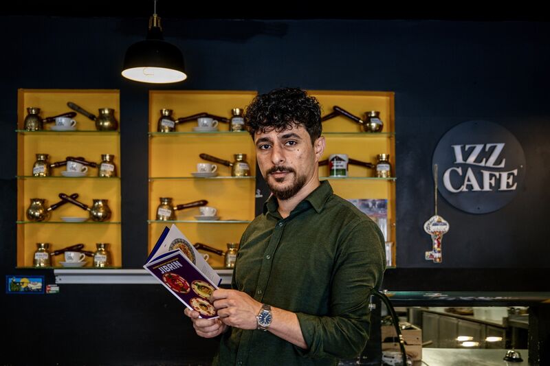 Chef Habib Al Ostaz reads from Jibrin, the new cookery book co-authored with Izz and Eman Alkarajeh, at Izz Café, Cork City. Picture Chani Anderson. Chef Habib Al Ostaz reads from Jibrin, the new cookery book co-authored with Izz and Eman Alkarajeh, at Izz Café, Cork City. Picture Chani Anderson.