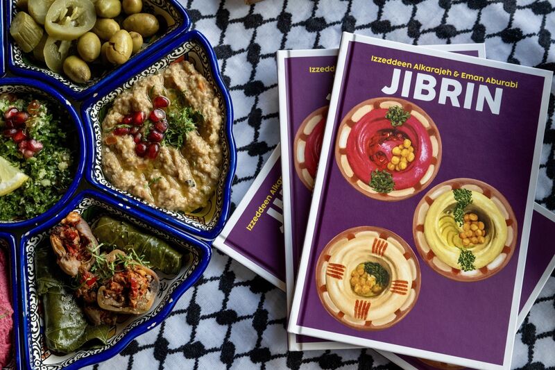 Jibrin, the new cookery book by Izz and Eman Alkarajeh and chef Habib Al Ostaz, pictured alongside freshly made dishes from the book at Izz Café, Cork City. Picture Chani Anderson. Jibrin, the new cookery book by Izz and Eman Alkarajeh and chef Habib Al Ostaz, pictured alongside freshly made dishes from the book at Izz Café, Cork City. Picture Chani Anderson.