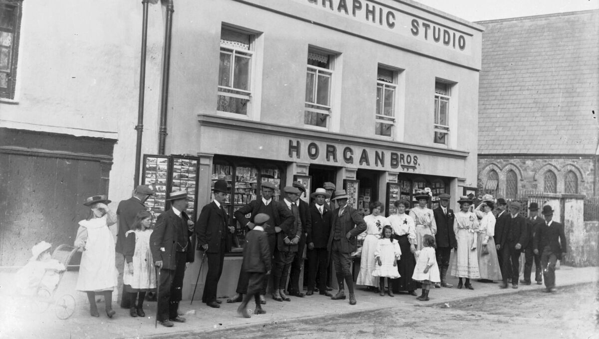 A group outside the Horgan Photographic Studio in Youghal, Co Cork, understood to feature Henry Ford. Picture: Horgan family collection