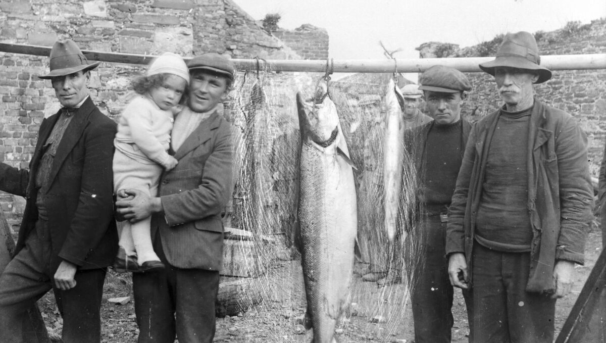 Fishermen with their catch and a child. Picture: Horgan family collection