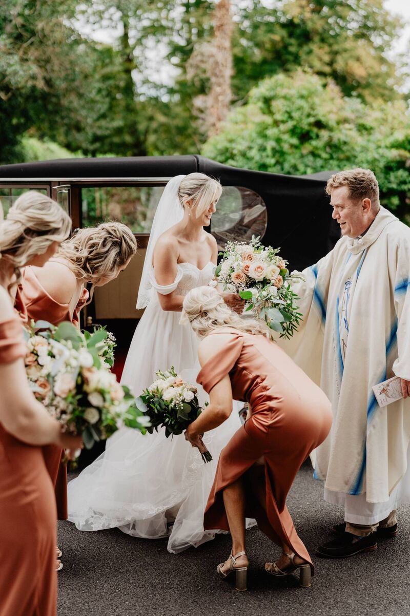 Fr Paddy Byrne with Chloe Brennan and her bridal party. 