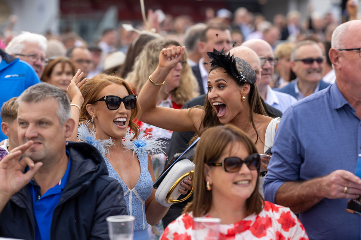 Emer Roche and Kate Geraghty, both from Tuam, cheer on Emer’s brother jockey Leigh Roche to victory onboard Nans view. Pic: ©INPHO/Morgan Treacy