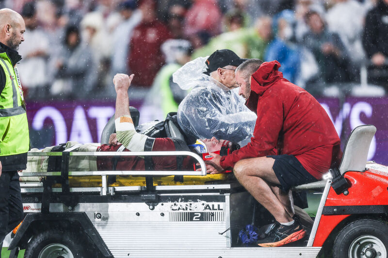 Lions' James Ryan gives a thumbs up as he is stretchered off the pitch. Pic: ©INPHO/Tom Maher.