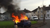Three men flee after setting car alight in 'quiet, respectable' Dublin suburb