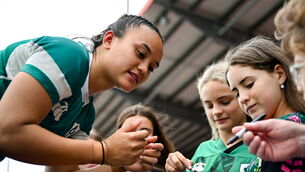 <p>Nancy McGillivray of Ireland signs autographs for supporters after the Women's Rugby World Cup warm-up match between Ireland and Scotland at Virgin Media Park in Cork. Photo by Shauna Clinton/Sportsfile</p>