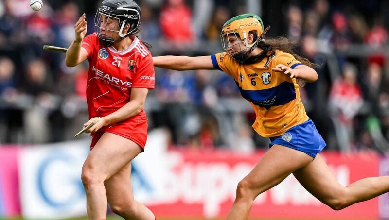 Amy O'Connor of Cork in action against Abby Walsh of Clare during the Munster Senior Camogie Championship semi-final. Pic: Brendan Moran/Sportsfile