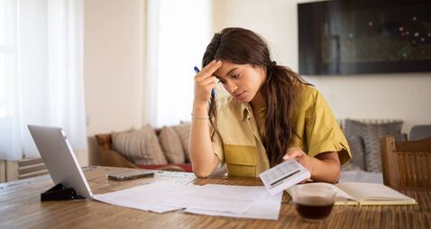 Young woman going through paperwork