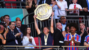 <p>Oliver Glasner lifts the shield with players following Palace’s victory (John Walton/PA)</p>