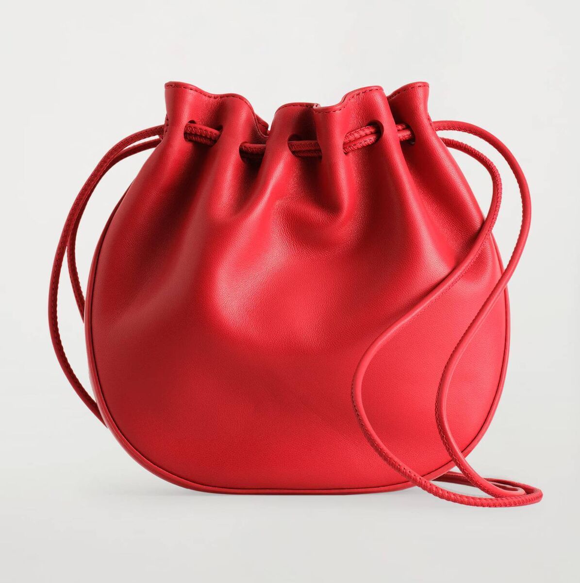 Gathered leather pouch bag, COS, €59.40