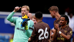 <p>WEST END BOYS: Brentford goalkeeper Caoimhin Kelleher applauds the fans after a pre-season friendly match at Loftus Road Stadium. Pic: John Walton/PA Wire.</p>