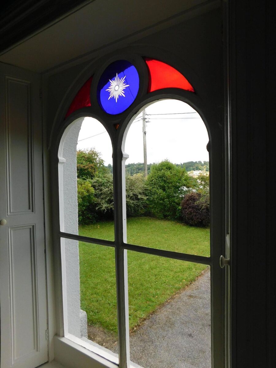 Church-style window in entrance porch