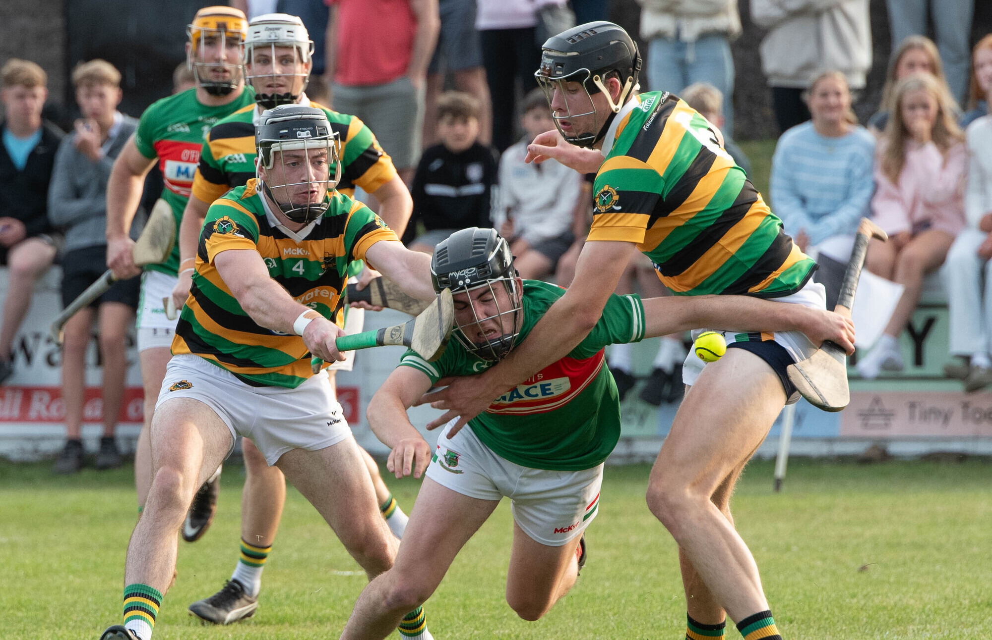 Fr O'Neill's John Millerick stumbles to the ground as he is challenged by Glen Rovers Liam Coughlan and Robert Downey during the Premier Senior Hurling Championship match in Midleton. Picture: Howard Crowdy