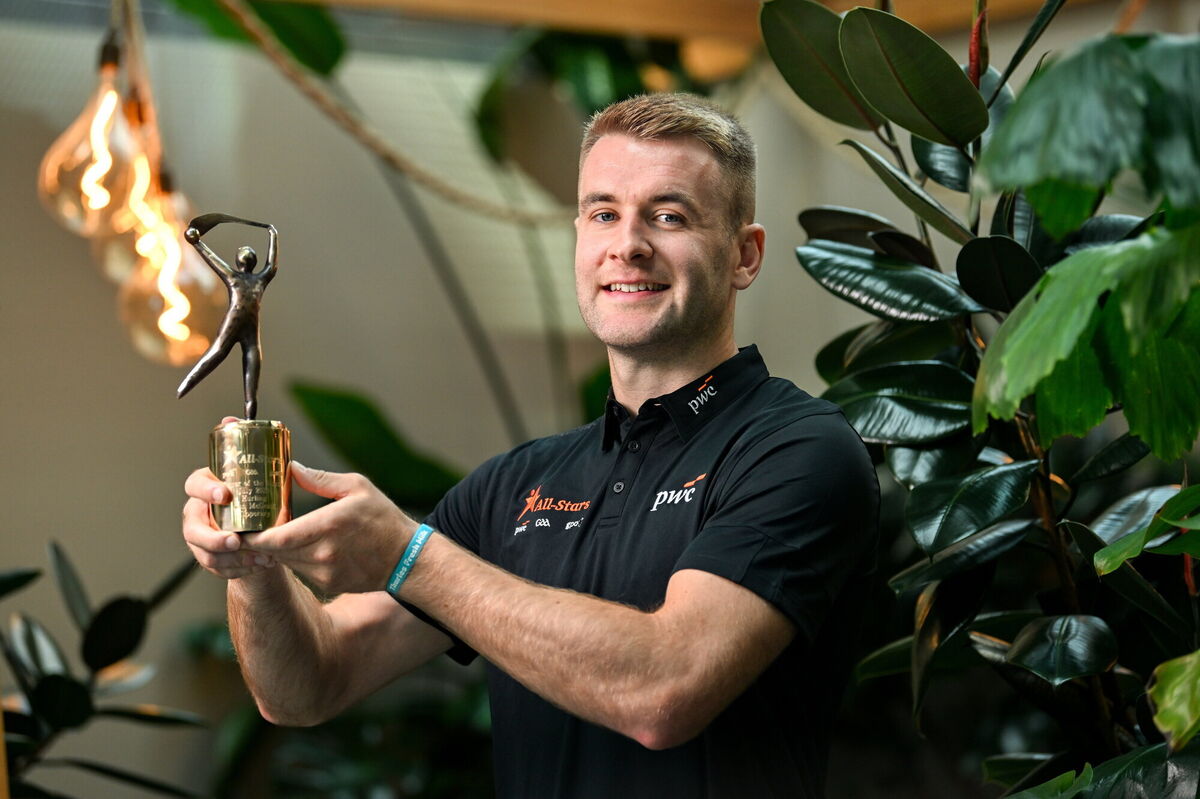 PwC GAA/GPA Player of the Month for July in hurling, John McGrath of Tipperary, with his award at PwC offices in Dublin. Photo by Ramsey Cardy/Sportsfile