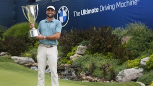 <p>Scottie Scheffler holds the trophy after winning the BMW Championship. Pic: AP Photo/Stephanie Scarbrough.</p>