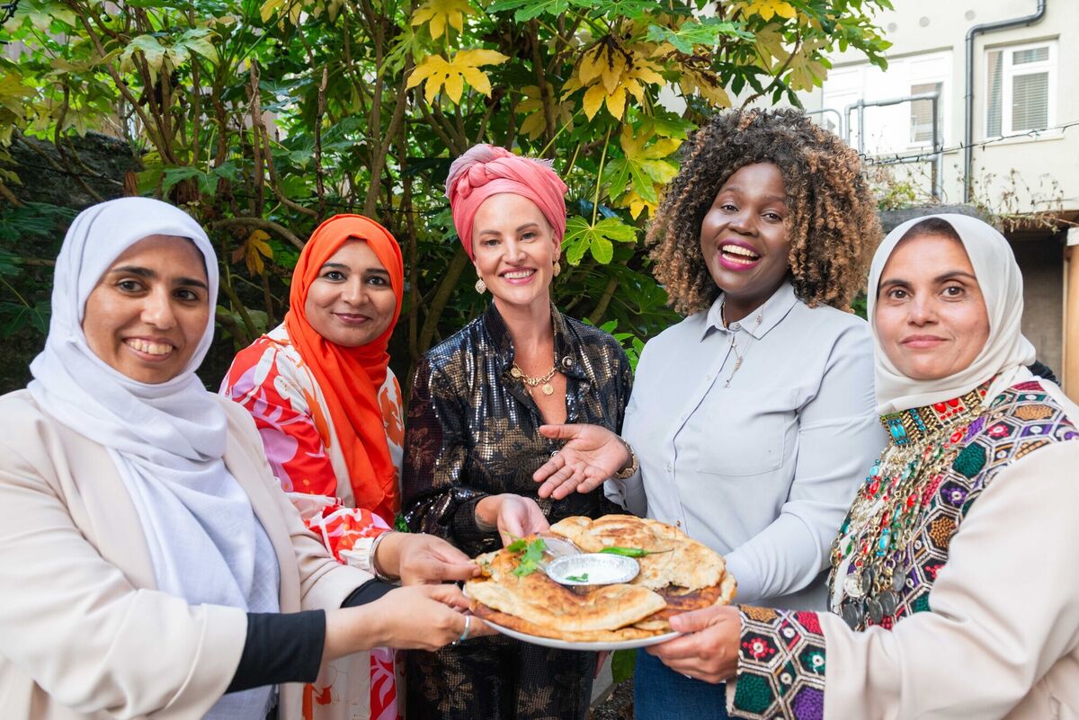 Pictured L–R: Fahmeda Naheed, Farahnaz Haidary, Chef Orla McAndrew, Phumie Nkosi Casserly, and Nadija Sedigi enjoying Breaking Bread: A Cultural Connection at St. Peter’s, Cork. The immersive food and community experience celebrated Cork’s migrant food scene, blending heritage and local flavours, with performances by the Cork Shakespearean Company and other community groups. Photo: Joleen Cronin