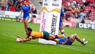<p>Australia's Cecilia Smith scores their side's eighth try of the game. Pic: Mike Egerton/PA Wire.</p>
