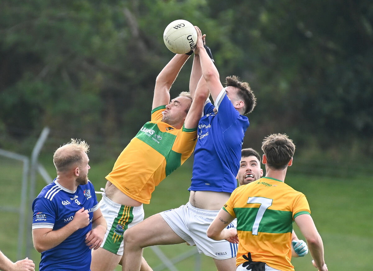 Jack O Donnchu of Naomh Aban battles in the air with Glanmire's Tiernan Hourihan, during their Premier IFC clash at Coachford. Picture: David Keane.