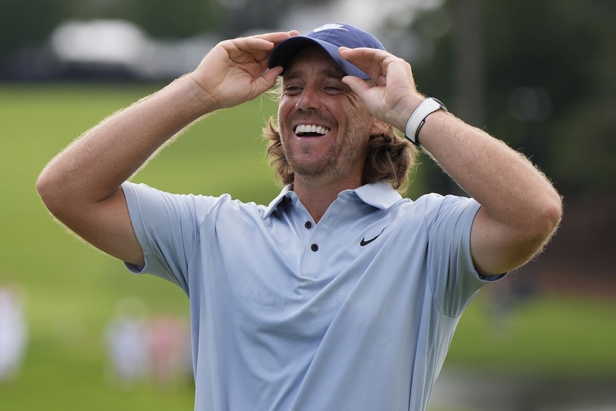 Tommy Fleetwood, of England, celebrates victory during the final round of the Tour Championship. Pic: AP Photo/Mike Stewart