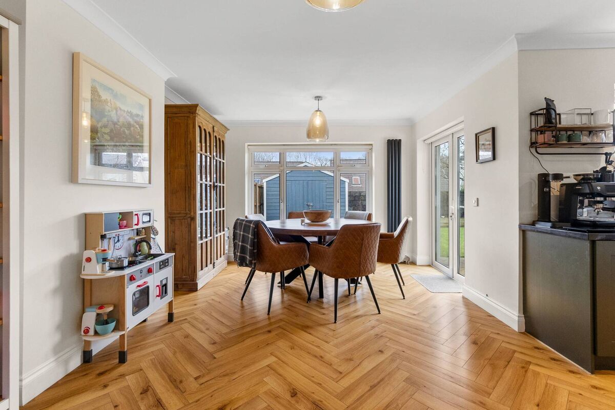 Open plan dining room with herring bone floor Open plan dining room with herring bone floor