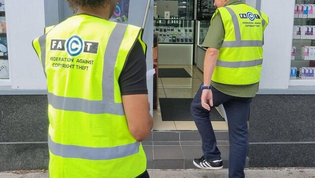 <p>FACT employees delivering a notice to a premises last month.</p>