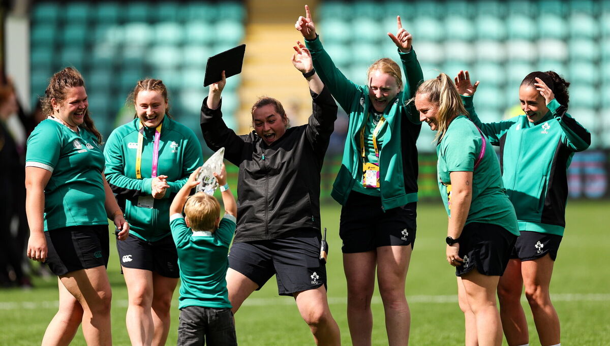 PART OF THE FAMILY: Ellena Perry, left, and her son Bert celebrate with players and staff, including sports scientist Ruth Montgomery, centre. Pic: Harry Murphy/Sportsfile