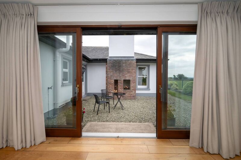 Double doors from extended bedroom lead to a courtyard Double doors from extended bedroom lead to a courtyard