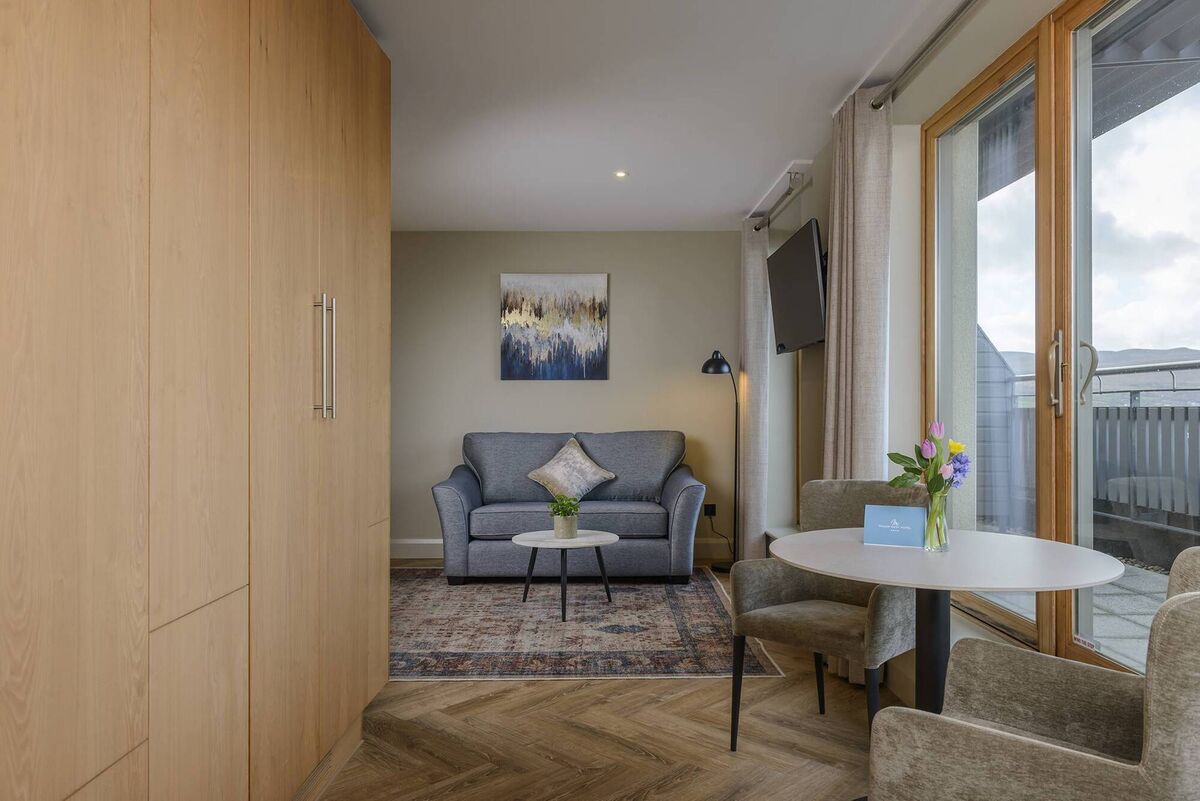 The Suites in Manor West Hotel offer a spacious blend of comfort and style, featuring a beautifully appointed bedroom and lounge area. The Suites in Manor West Hotel offer a spacious blend of comfort and style, featuring a beautifully appointed bedroom and lounge area.