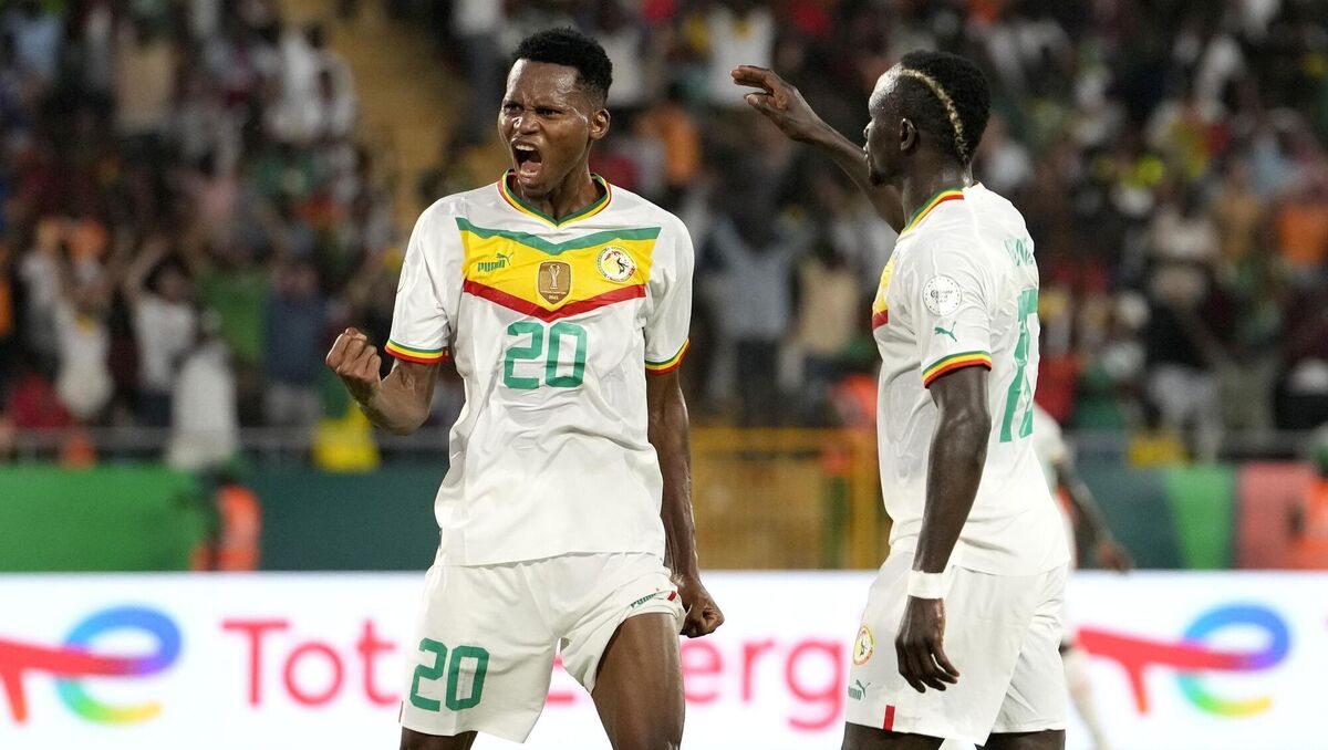 Senegal's Habib Diallo, left, celebrates with teammate Sadio Mane. Pic: Sunday Alamba/AP